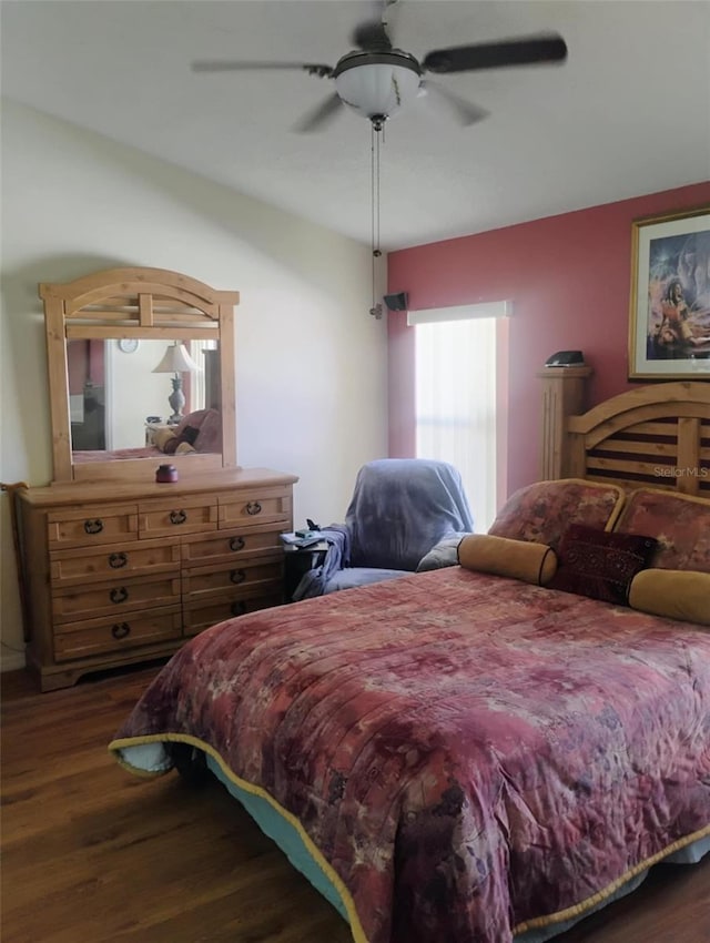 bedroom featuring dark wood-style floors and ceiling fan