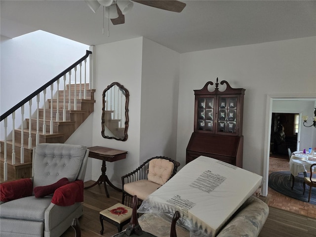 interior space with ceiling fan and dark wood-type flooring