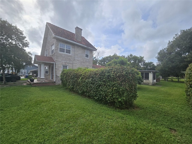 view of home's exterior with a yard