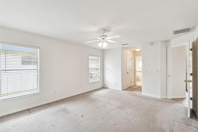 carpeted empty room with ceiling fan