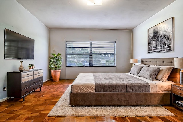 bedroom featuring parquet flooring