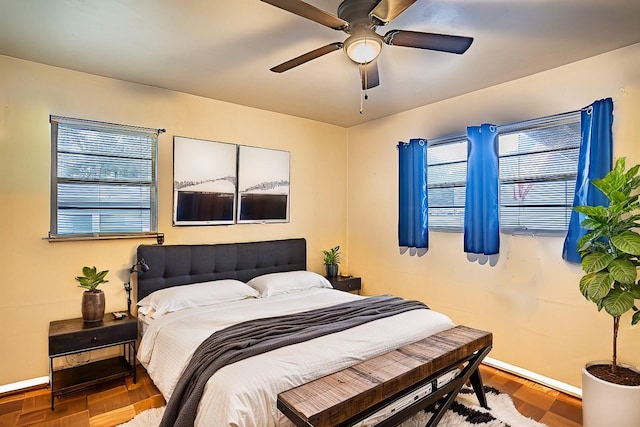 bedroom featuring hardwood / wood-style floors and ceiling fan