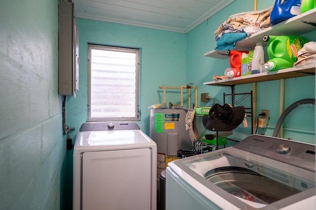 laundry room featuring crown molding and washer and clothes dryer