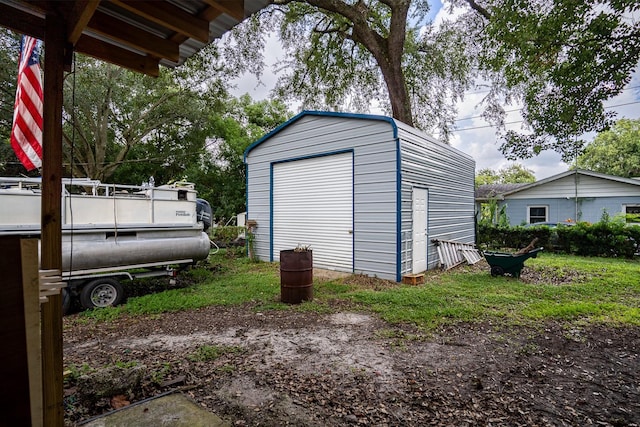 view of outbuilding with a garage