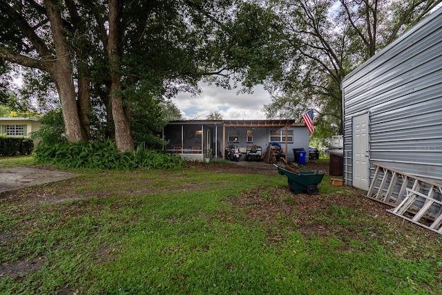 view of yard with a sunroom