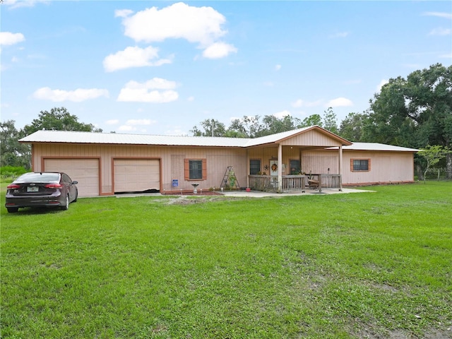 4485 Murphy Rd, Ona, FL 33865 - rear view of property with a yard and an attached garage