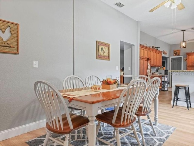 dining room featuring light wood-type flooring and ceiling fan