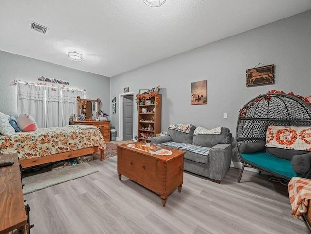 bedroom featuring light wood-type flooring