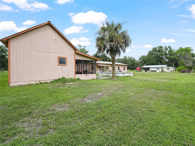 view of yard featuring a sunroom