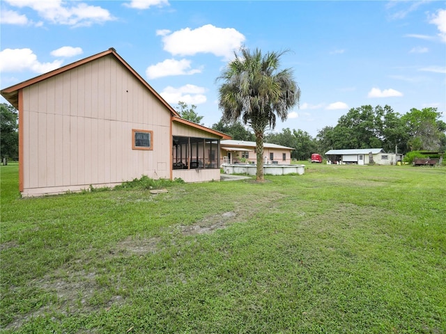 4485 Murphy Rd, Ona, FL 33865 - view of grassy yard featuring a sunroom