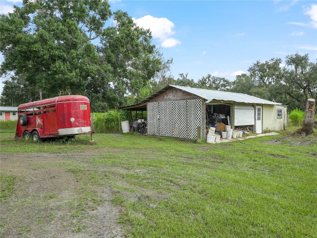 view of yard with an outbuilding and a garage