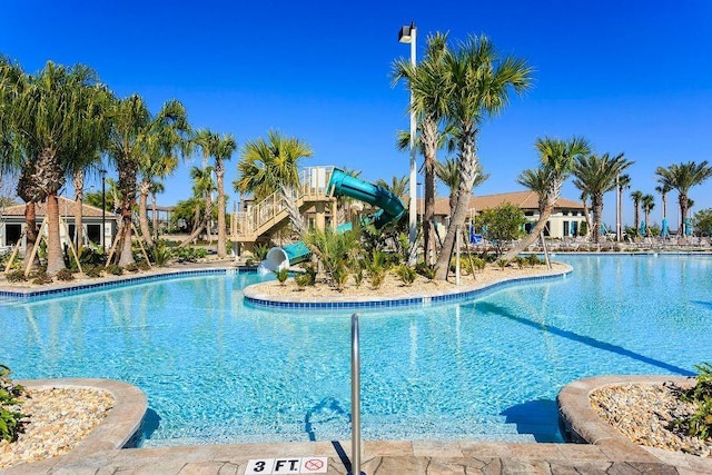 view of swimming pool featuring a water slide