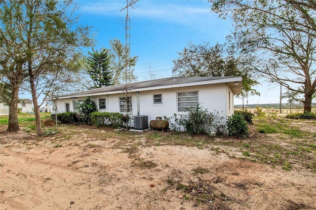 back of property featuring cooling unit