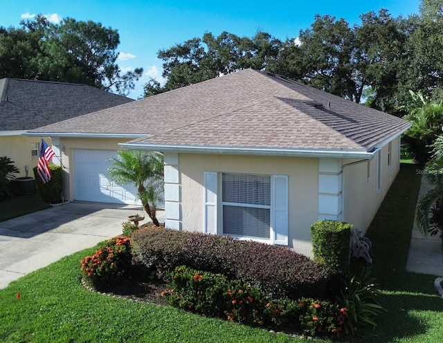 single story home with a front lawn and a garage