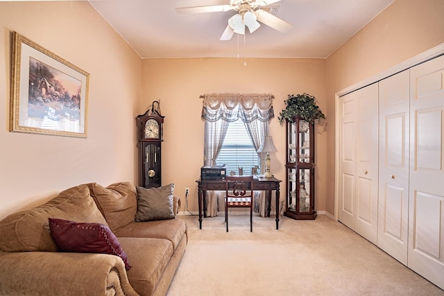 office area with ceiling fan and light colored carpet