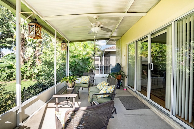 sunroom featuring a wealth of natural light and ceiling fan