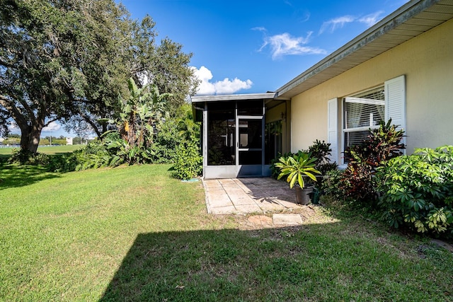 view of yard with a sunroom