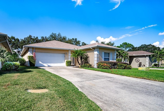 view of front of house with a garage and a front yard