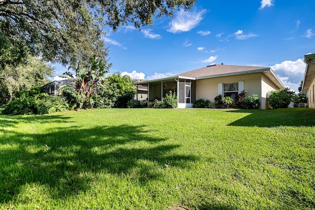 view of yard with a sunroom