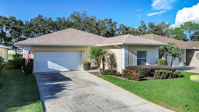 ranch-style house featuring a garage and a front yard