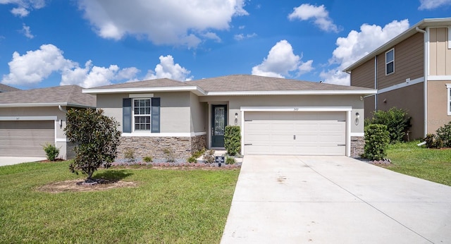 view of front facade with a front yard and a garage