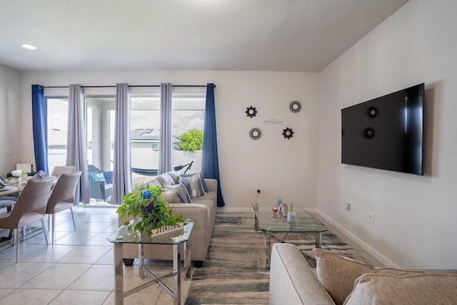 tiled living room with a textured ceiling