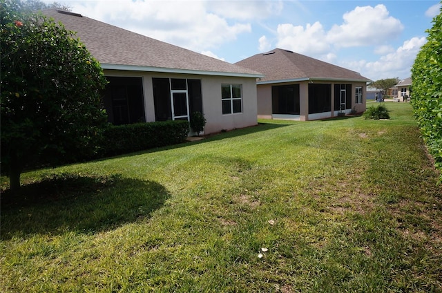 view of yard with a sunroom