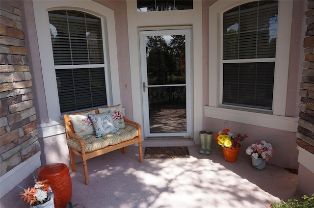 entrance to property featuring covered porch