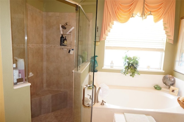 bathroom featuring separate shower and tub