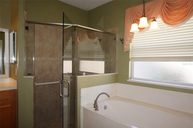 bathroom featuring vanity and separate shower and tub