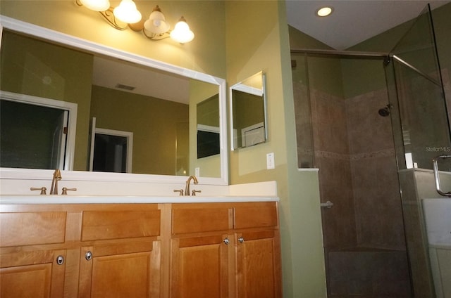 bathroom featuring vanity and walk in shower