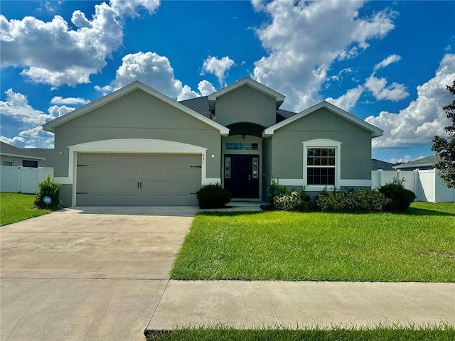 view of front of house featuring a front yard and a garage