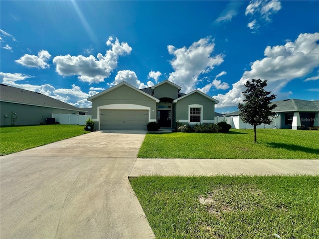 view of front of property with a garage and a front lawn