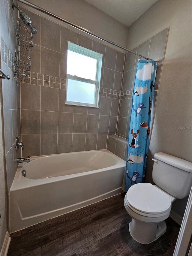 bathroom featuring shower / bath combination with curtain, hardwood / wood-style flooring, and toilet