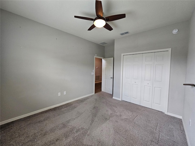 unfurnished bedroom featuring ceiling fan, a closet, and carpet