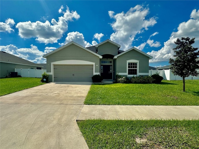 view of front of house with a garage and a front lawn