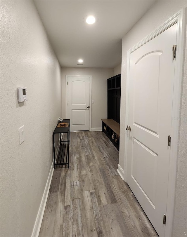 corridor featuring light wood-type flooring