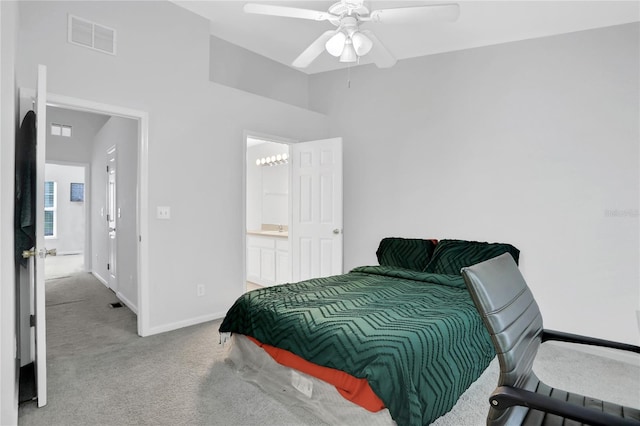 bedroom featuring carpet floors, ensuite bathroom, and ceiling fan