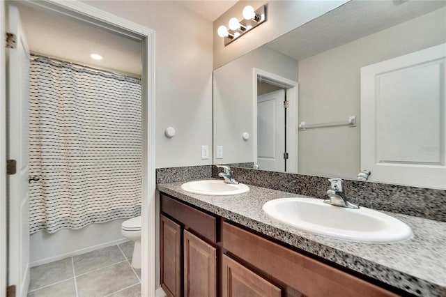 full bathroom with shower / bathtub combination with curtain, vanity, a textured ceiling, toilet, and tile patterned floors