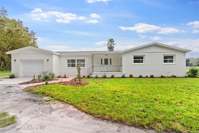 ranch-style house with a front yard and a garage