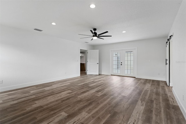 unfurnished living room featuring ceiling fan, recessed lighting, baseboards, wood finished floors, and visible vents