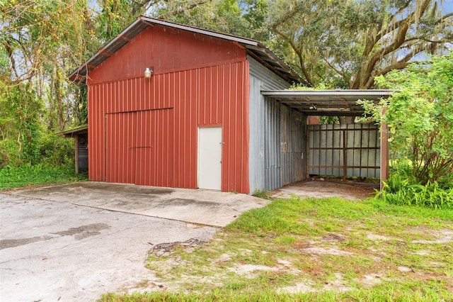 view of outbuilding featuring a carport