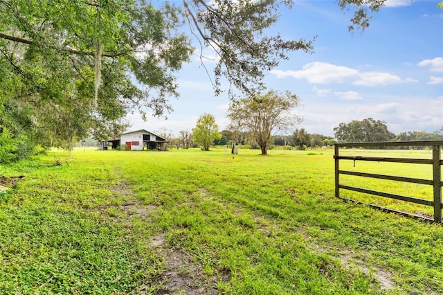 view of yard with a rural view