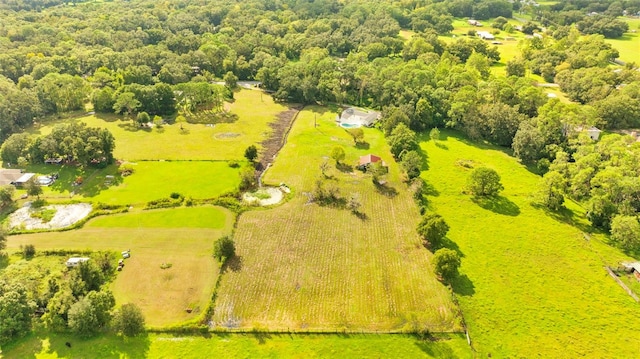 birds eye view of property with a rural view