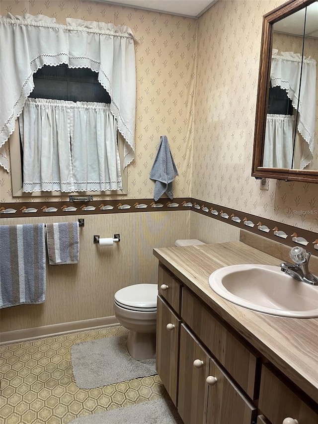 bathroom with vanity and toilet