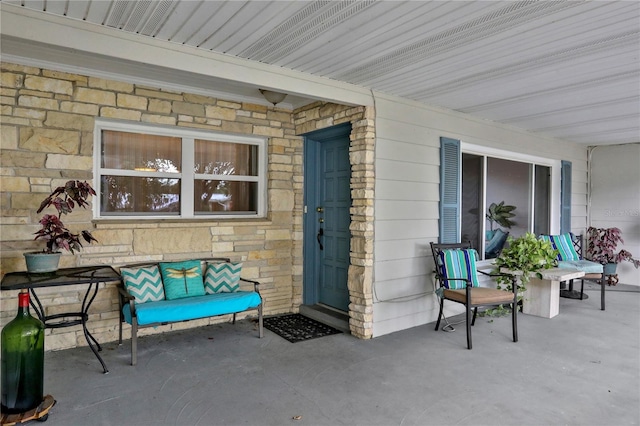 entrance to property featuring a patio area