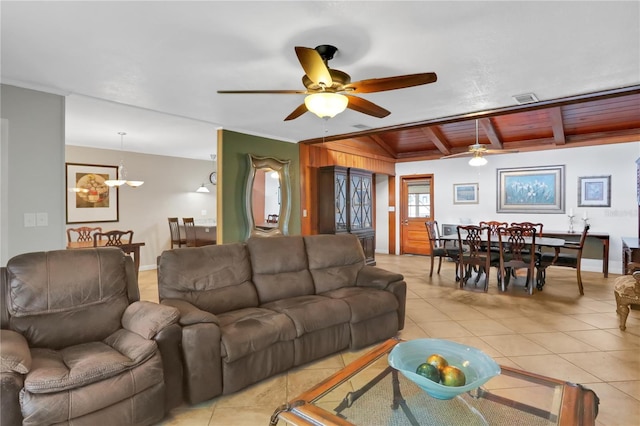 tiled living room featuring ceiling fan