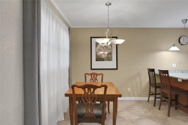 tiled dining space with an inviting chandelier