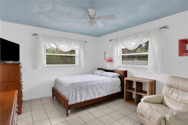 tiled bedroom with ceiling fan