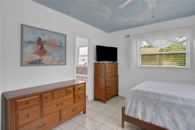 tiled bedroom featuring ceiling fan